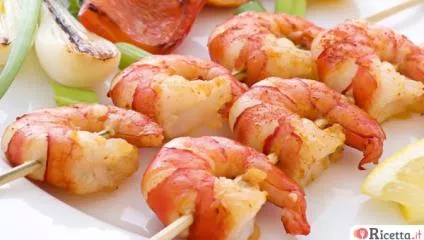 Spiedini di pesce in padella e al forno